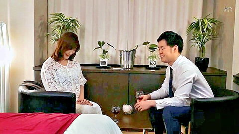Aya Kaname in lace blouse smiling at suited man with wine in intimate JAV scene
