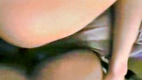 Closeup of wet shaved pussy with pink labia exposed as gray panties pulled aside