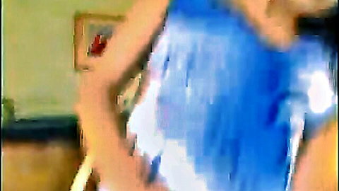 Skinny olive brunette teen in sheer blue top teasing curves in bedroom