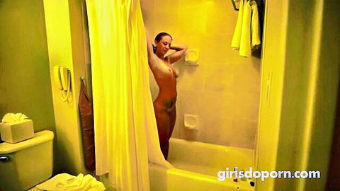 Layla London nude posing in bathroom, arms up teasing breasts