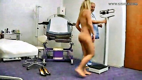 Blonde Lisa nude in gyno clinic exam, standing on scale