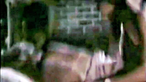 Blurry taboo encounter against brick wall, secret affair scene