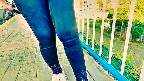 20-year-old Latina with thick ass in tight blue jeans teasing outdoors