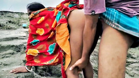 Indian couple fucking doggy style beside river in sari and lungi