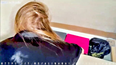 Blonde Russian MILF big ass view in shiny black top from behind