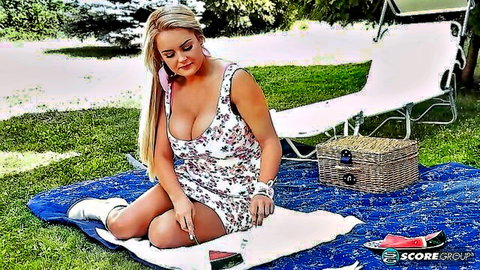 Katie Thornton in low-cut white dress, big boobs and ass outdoors