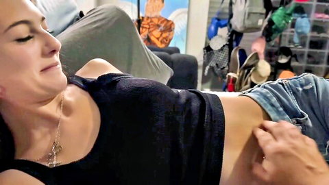 Sophie Tyler petite babe smiling with hand caressing exposed belly in black top and shorts
