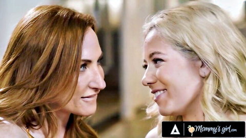 Redhead and blonde lesbians in intimate close-up, smiling seductively from lustful xxx movie