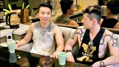 Four muscular Chinese guys in tank tops, casual group hangout