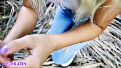 Blonde Turkish girl in ripped jeans teases outdoors in fields