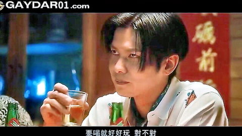 Handsome Chinese hunk with long hair sipping drink in gay edging video