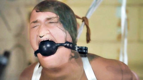 Green-haired bondage slave ball gagged drooling helplessly in humiliating BDSM restraint