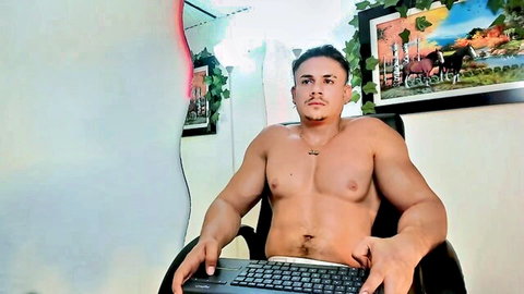 Muscular shirtless hunk in tight white briefs teases bulge with keyboard on lap