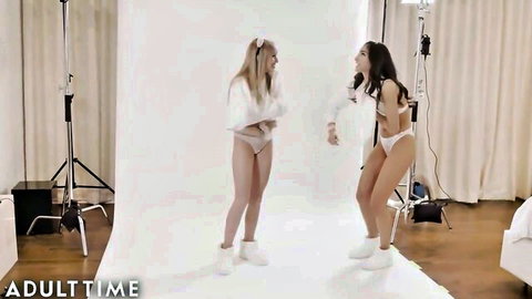 Emily Willis and Scarlett Sage in white lingerie, playful teasing pose