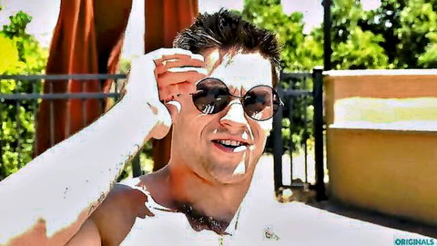 Solomon Aspen shirtless smiling at pool in sunglasses, bareback show