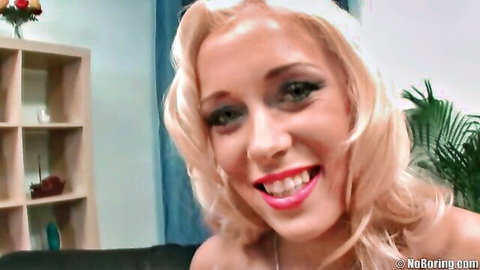 Slutty blonde smiling seductively, prepping for intense anal session