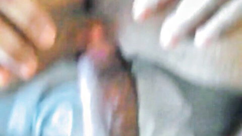 Black hands spreading open shaved pink pussy lips in explicit closeup