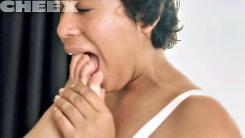 Puck Ellington licks Carmen Canela's toes in dominant scene