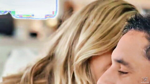 Blonde woman passionately kissing handsome DILF close-up intimate moment