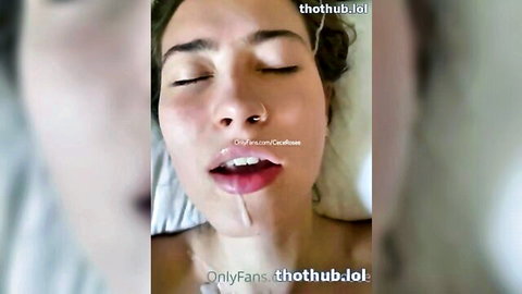 Cece Rose with cum dripping from open mouth, eyes closed in pleasure