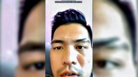 Close-up of handsome Asian Filipino man in selfie, celebrating Pinoy pride