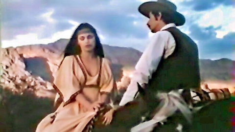 Retro Native American woman in fringe dress gazing at cowboy in desert western scene