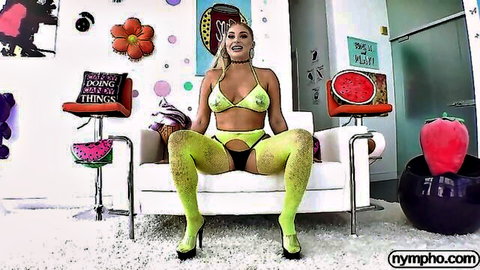 Busty blonde Kayley Gunner in green bikini and stockings posing seductively