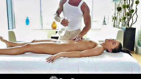 Adriana Chechik nude on massage table, oiled by masseur