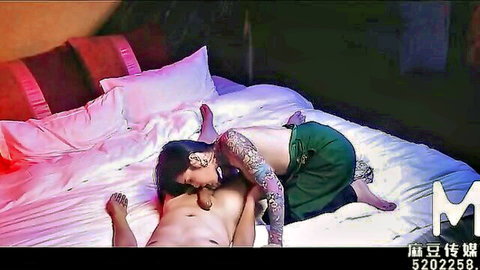 Tattooed Asian couple in intimate missionary sex with perfect breasts