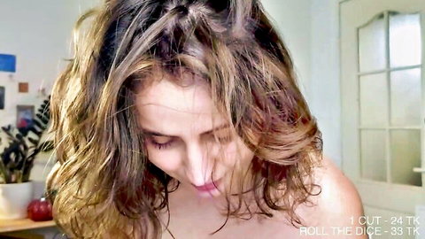Flaming_hotty close-up cam shot, wavy brunette hair, smiling down nude shoulders