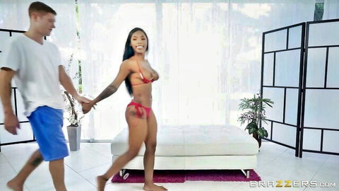 Sarah Banks in red bikini, big pierced tits, hand-in-hand with white guy