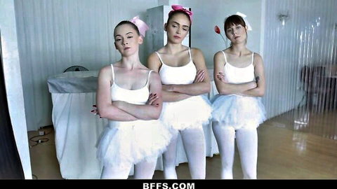 Three young brunette teen ballerinas in tight white tutus and camisoles crossing arms teasingly