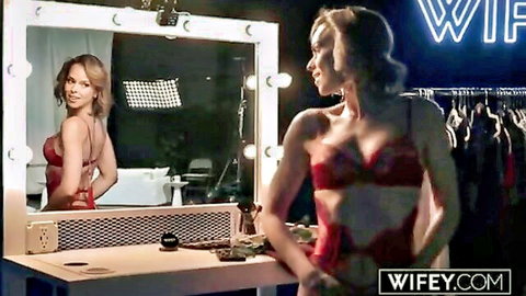 Serenity Cox in red lingerie mirror pose with blonde in hot threesome preview