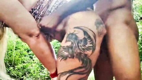 Blonde woman performs outdoor blowjob on tattooed man in wild fuck-fest