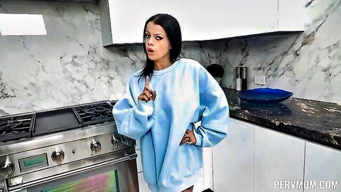 Sexy pervmom MILF in oversized blue hoodie posing hands on hips in kitchen