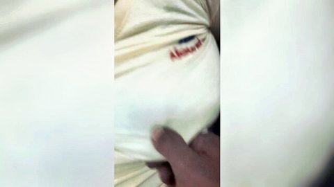 Tamil Aunty in white top pulled low, hand touching cleavage tease