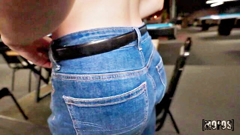 Curvy brunette big ass in tight blue jeans from behind near pool table