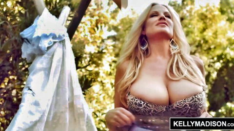 Buxom blonde Kelly Madison in leopard bra with deep cleavage outdoors