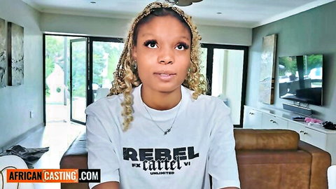 Ebony teen with braids in tight Rebel t-shirt on AfricanCasting.com casting couch