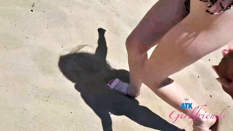Petite girlfriend's sexy legs and feet grabbed by boyfriend on beach