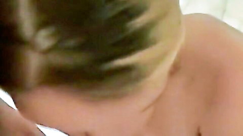 POV closeup of topless blonde teen's messy hair and bare shoulders during amateur blowjob