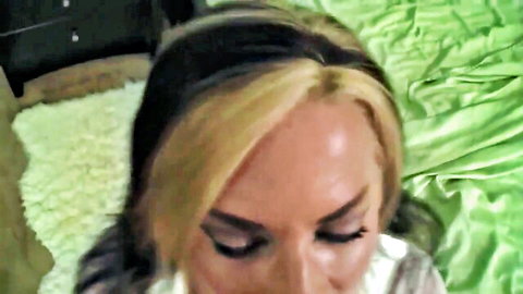 Sexy blonde MILF with smoky eyes looking up seductively in POV bedroom tease