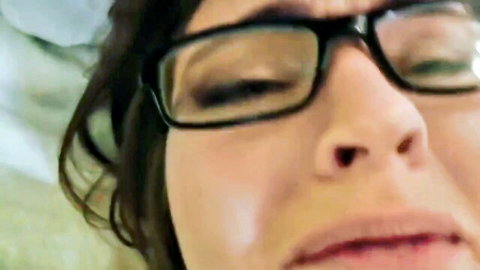 Aroused MILF in glasses close-up during creampie scene