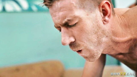 Close-up of handsome caucasian man with stubble moaning in ecstasy during Brazzers sex