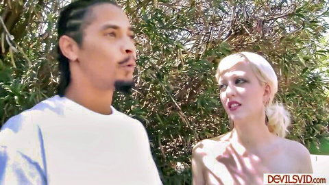 Busty blonde topless chatting with black stud outdoors