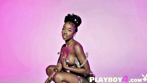 Petite black teen with big breasts in raunchy nude body paint pose