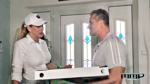 Dionne Darling in white blouse and cap chats with man, foursome setup