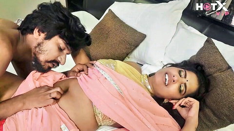 Indian bhabhi in pink saree teased intimately by devar in Hindi bedroom scene