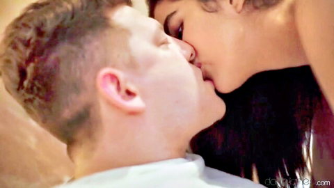 Michael Fly passionately kissing pretty brunette Asian in erotic romance scene