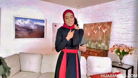 Jayne Doh in red hijab passionately embraces David Lee in black dress